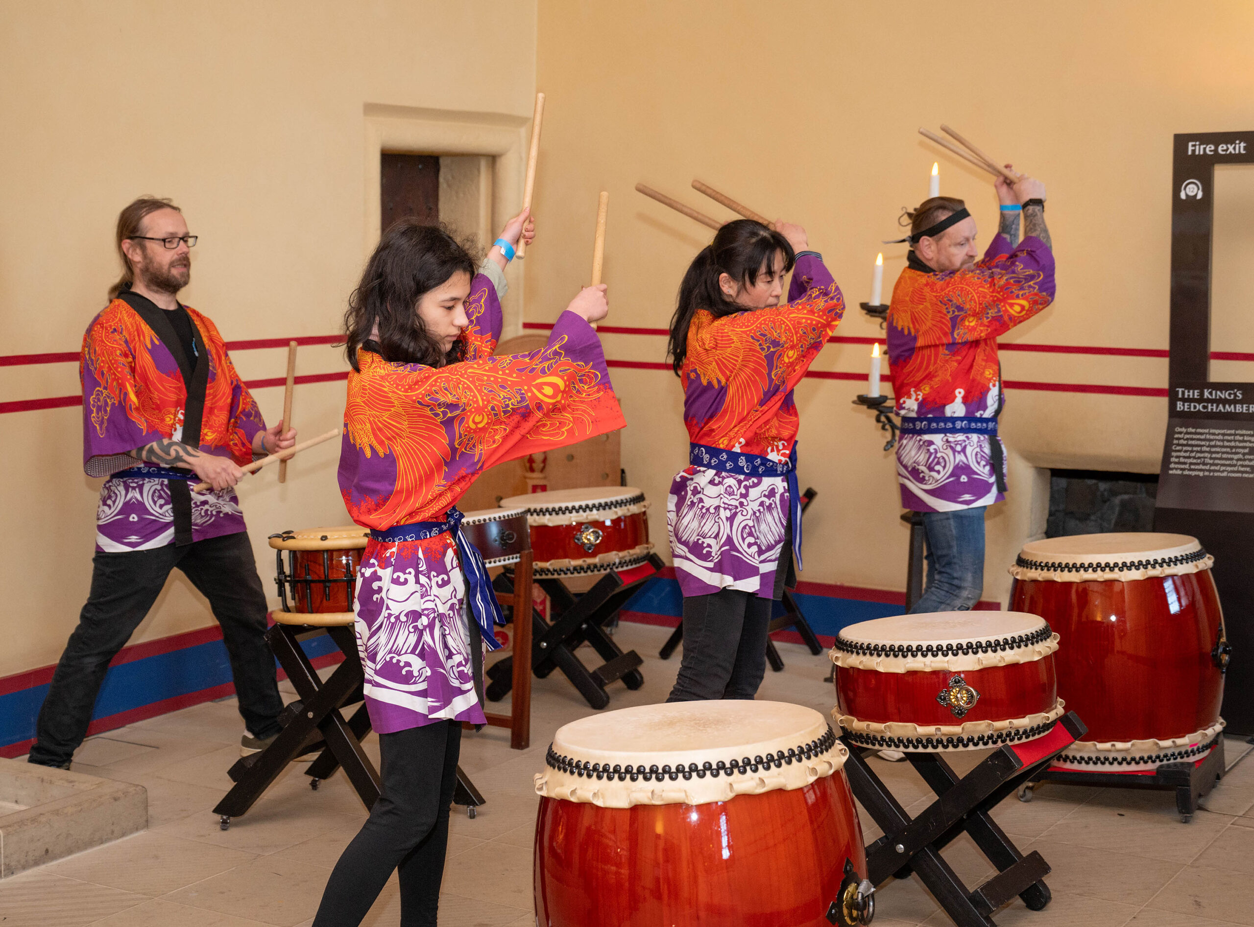 A group of people playing drums