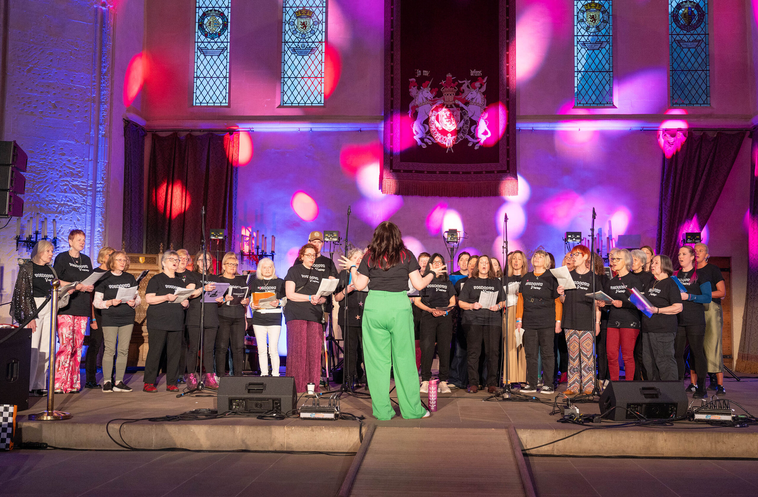 A choir singing in a hall at Stirling Castle