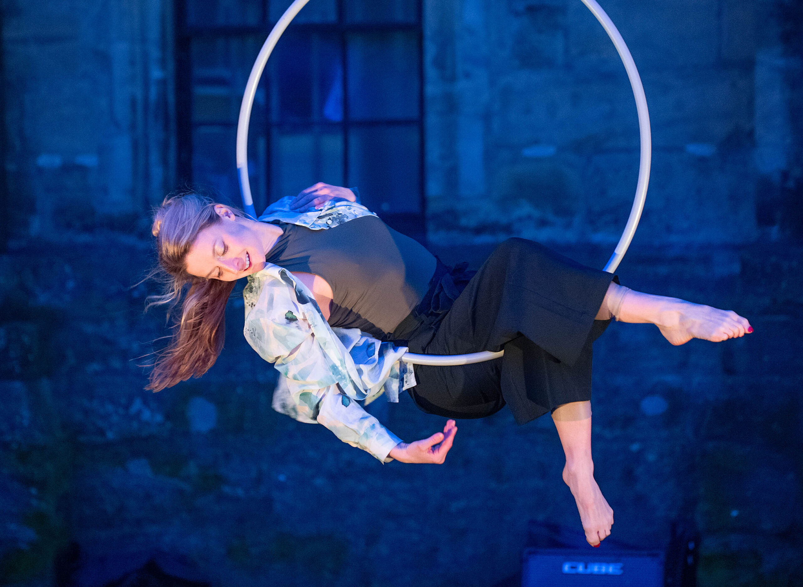 A woman doing aerial dancing